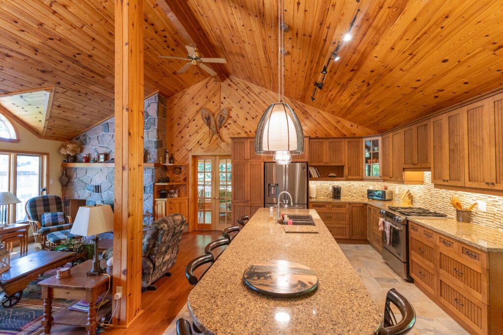 A rounded kitchen island in a wood kitchen