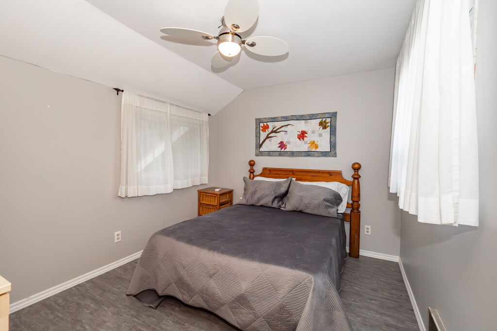 Neutral-toned bedroom with grey walls and soft lighting