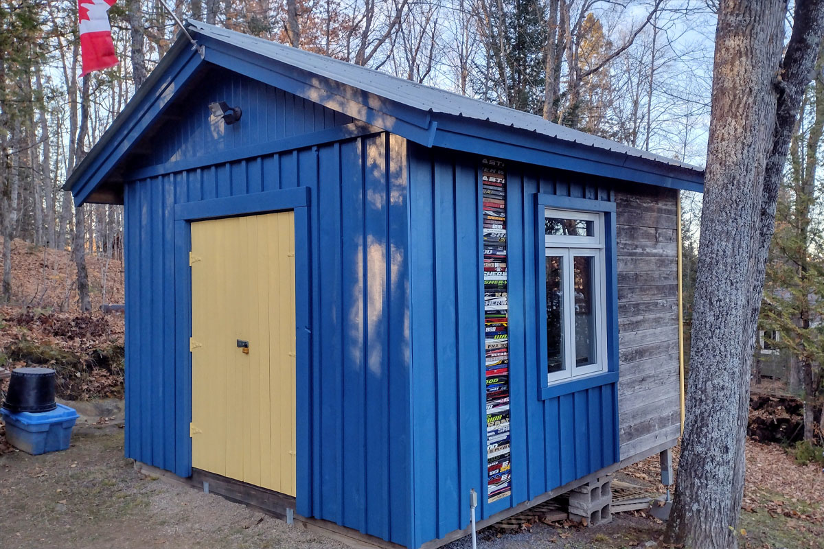 Blue and yellow cottage shed.