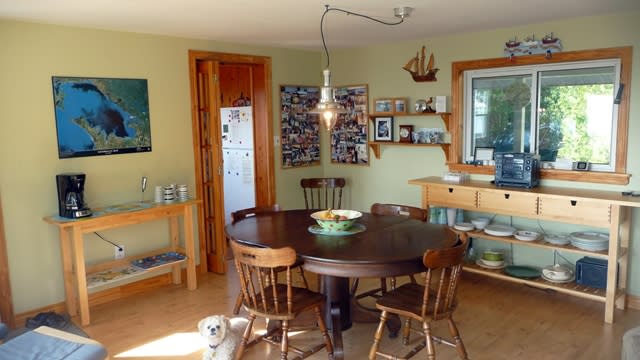 a round dark brown wood dining table