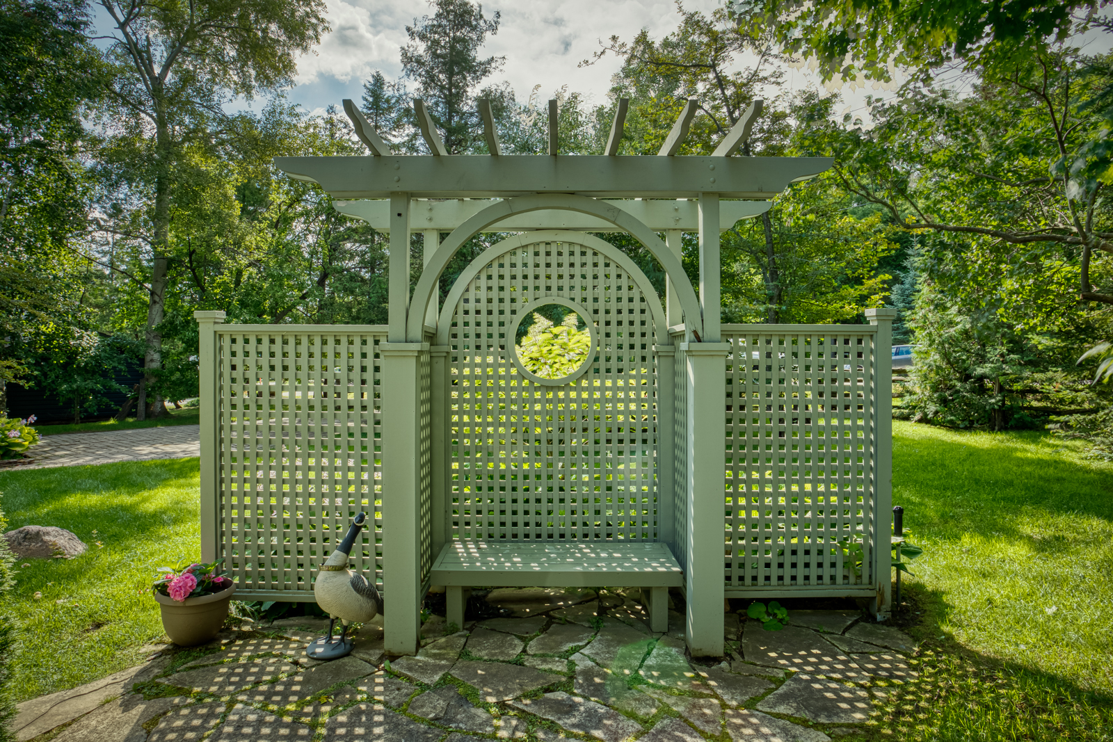 A green garden bench