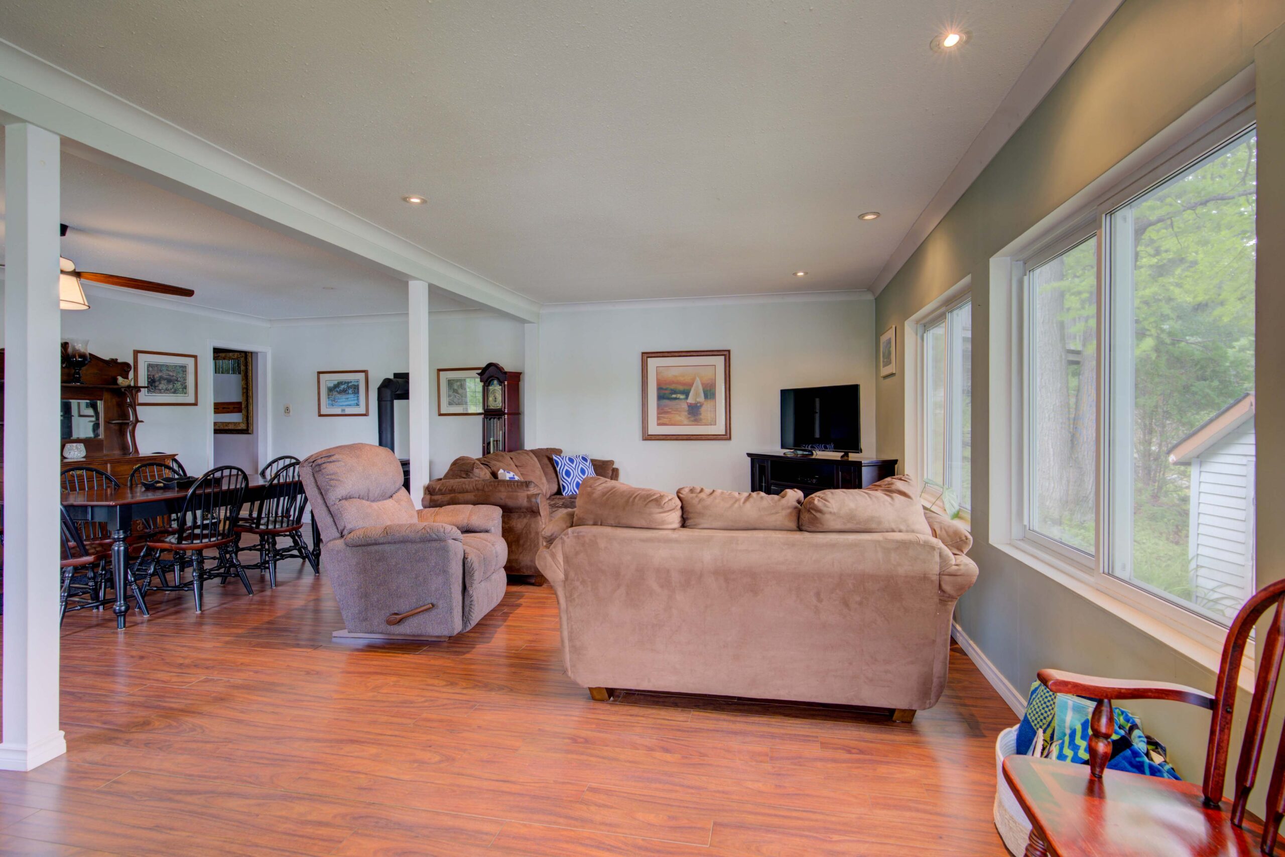 Brown suede couches face each other in a white living room