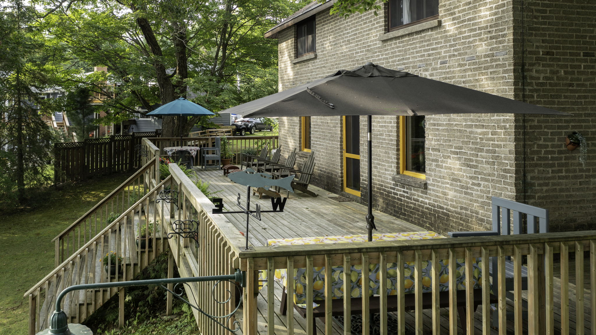 Raised deck area offering panoramic views of the lake and property