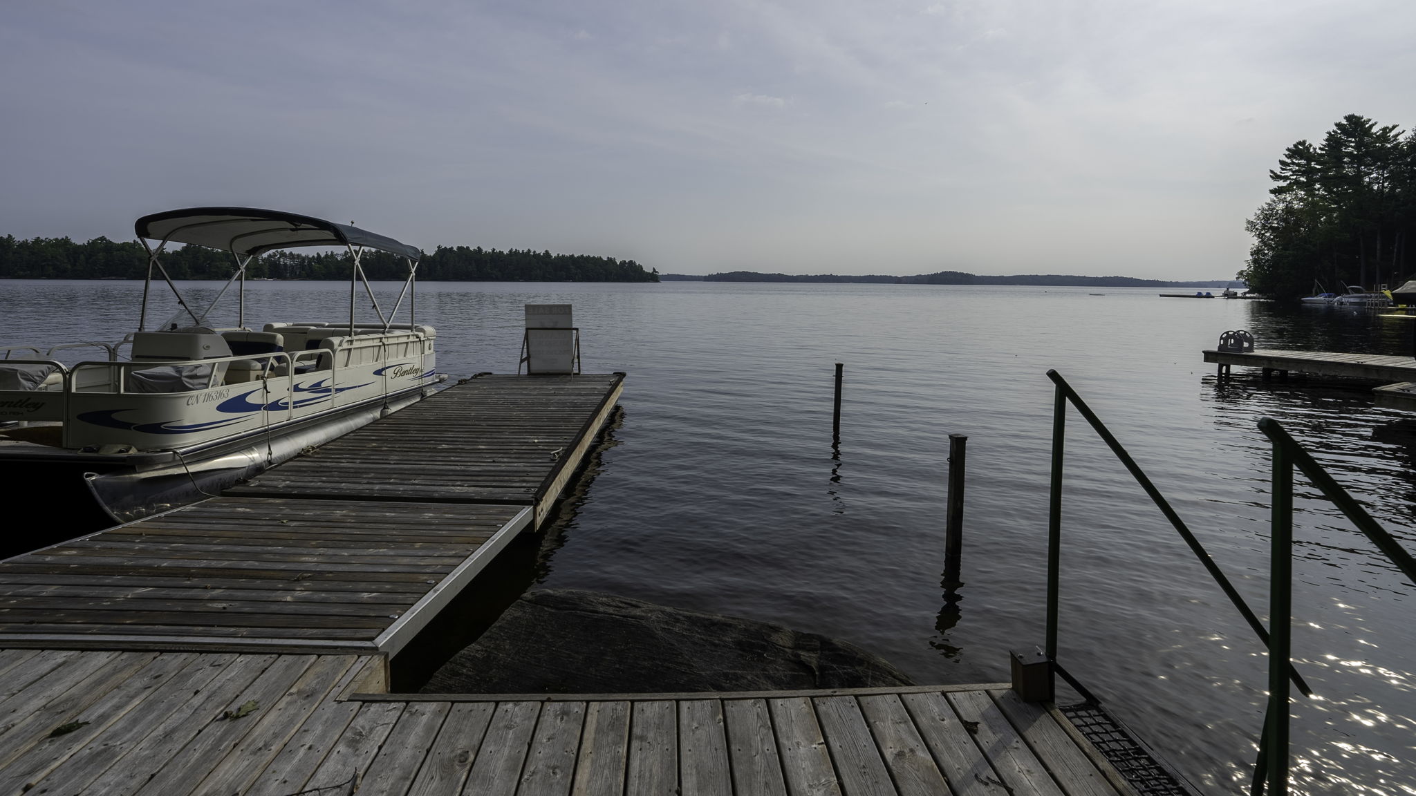 Floating dock and deck along the Lake Muskoka shoreline