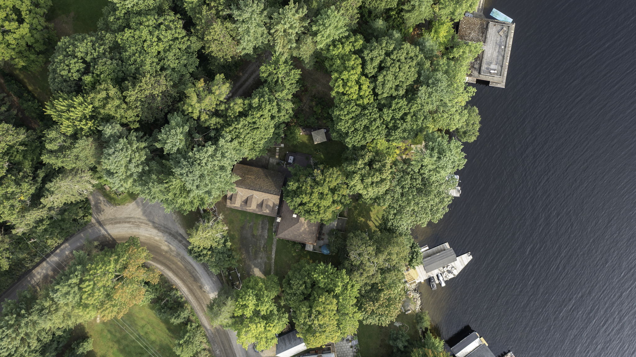 Top-down view of waterfront docks extending into Lake Muskoka