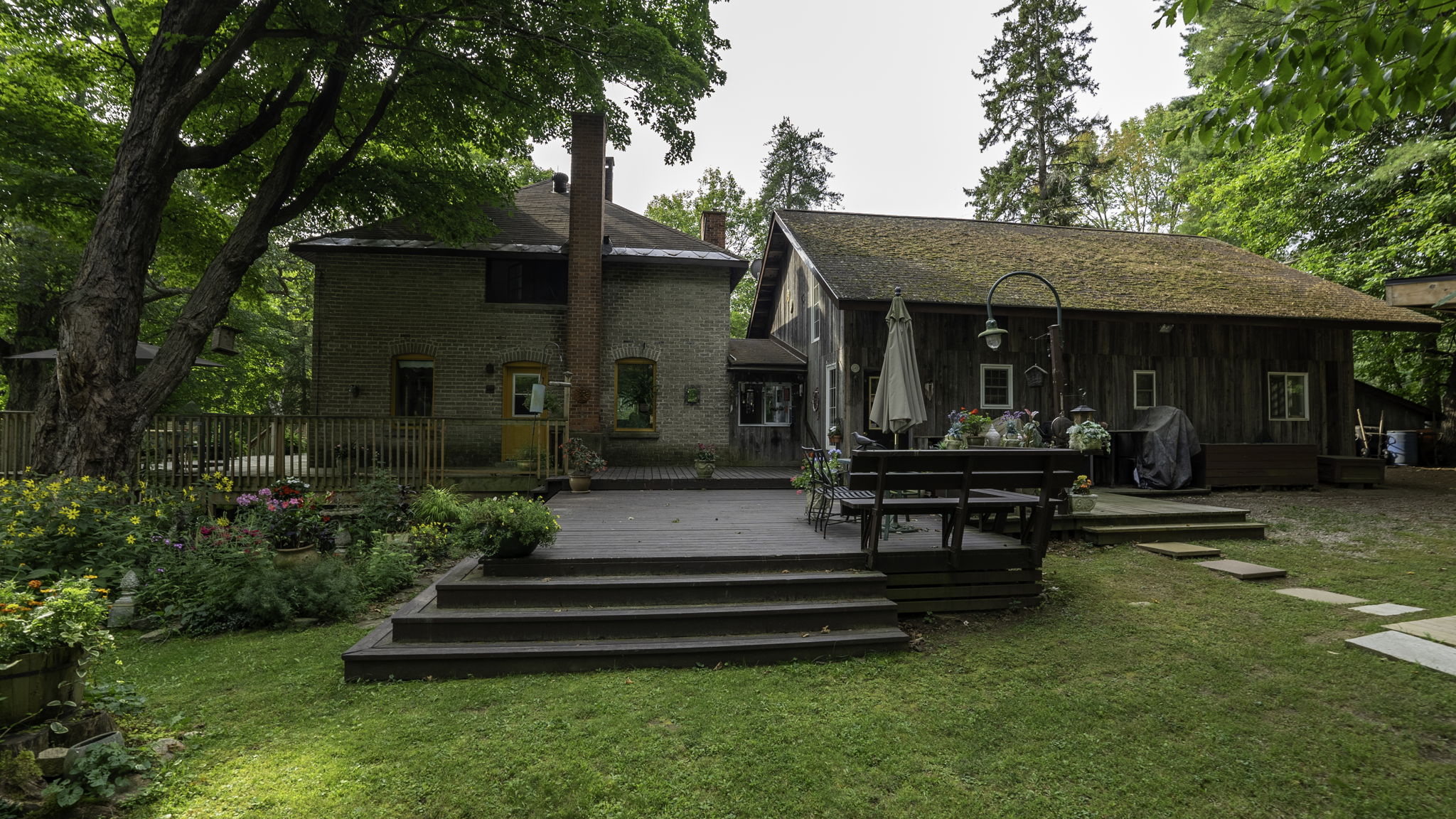 Grassy lawn area leading down to waterfront at Lake Muskoka