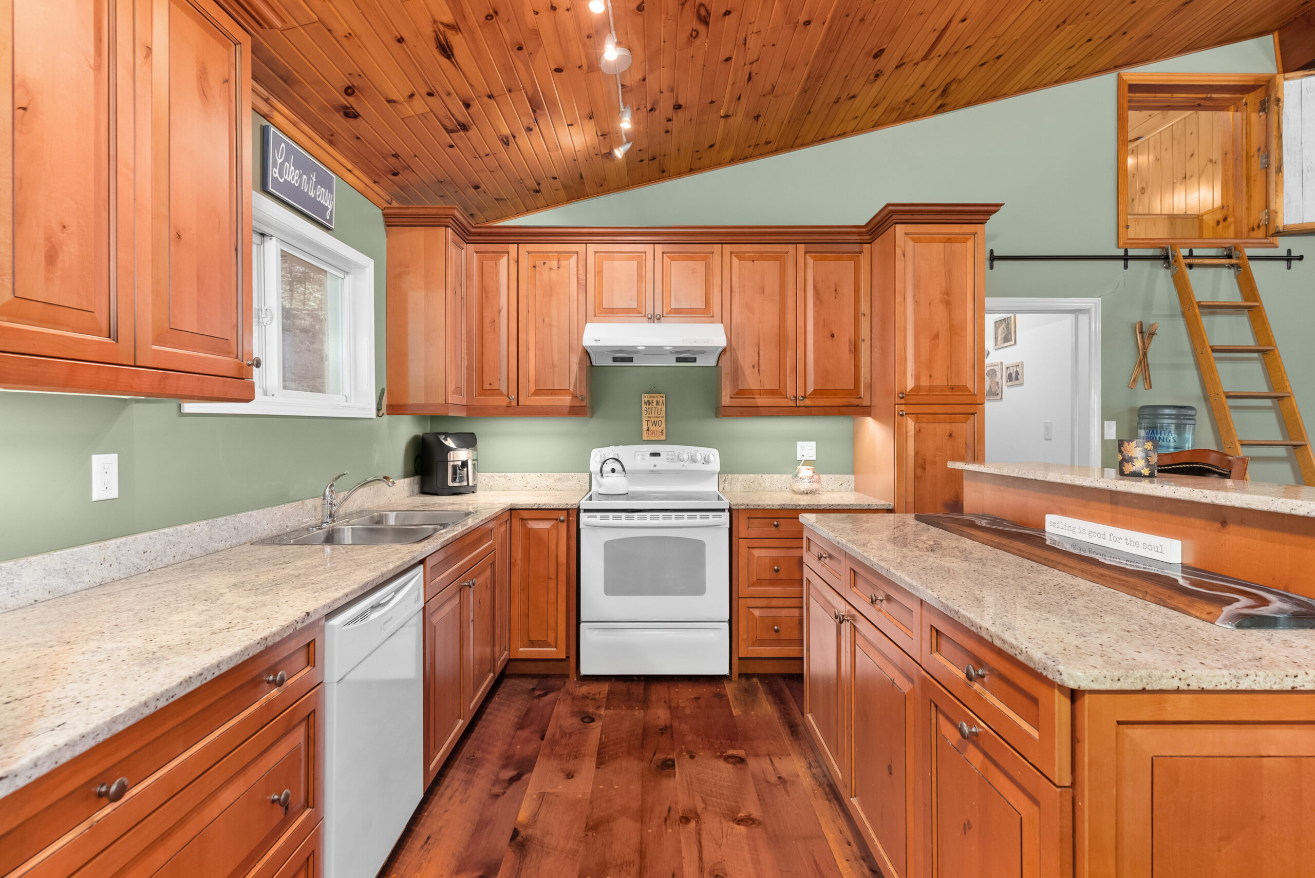 Classic kitchen design with ample counter space and river views from the sink.
