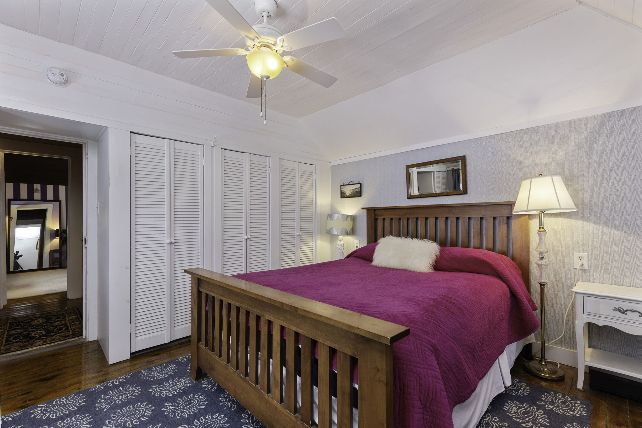 Bright bedroom with wood furnishings and natural light