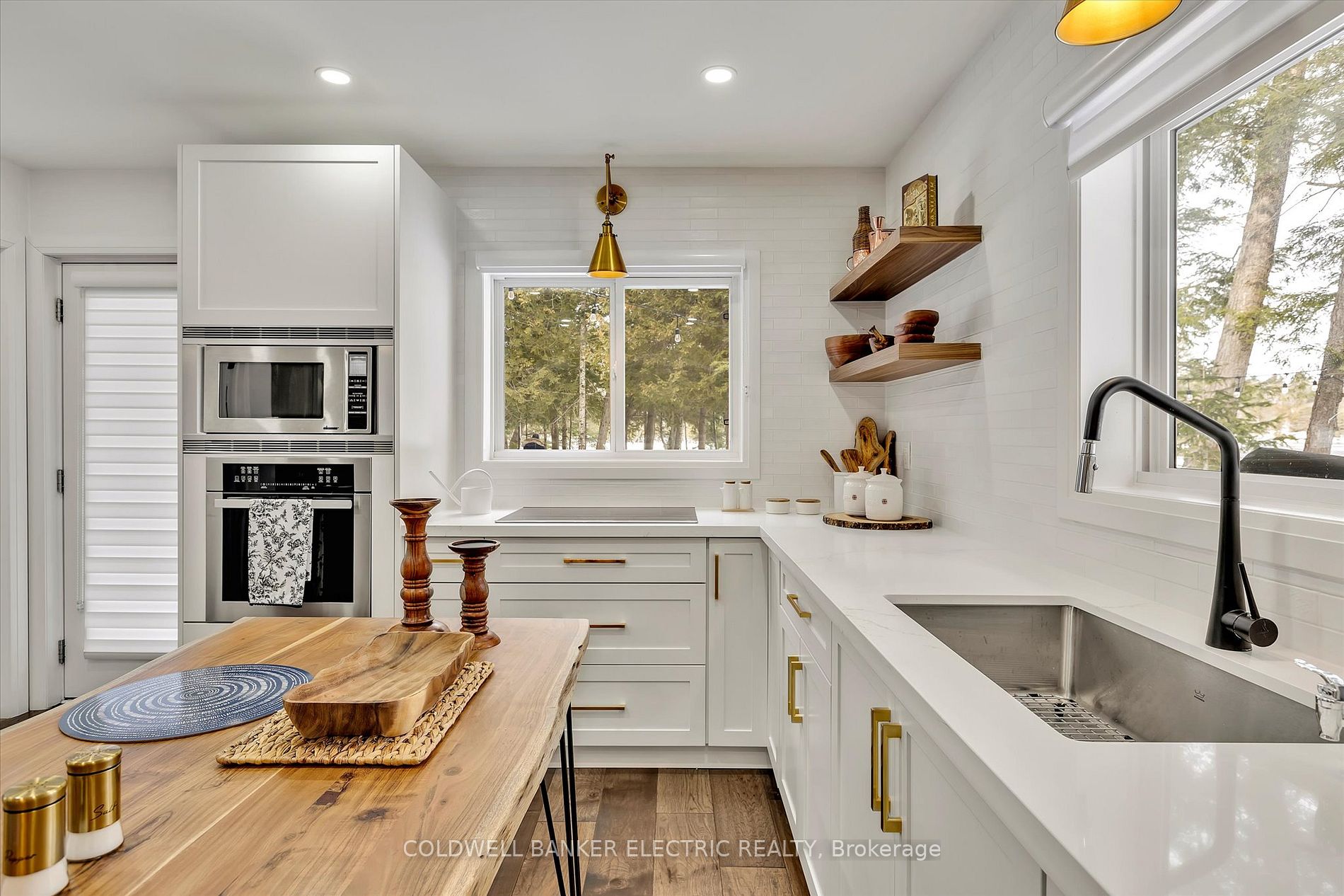 Clean, white cabinetry and wood countertops
