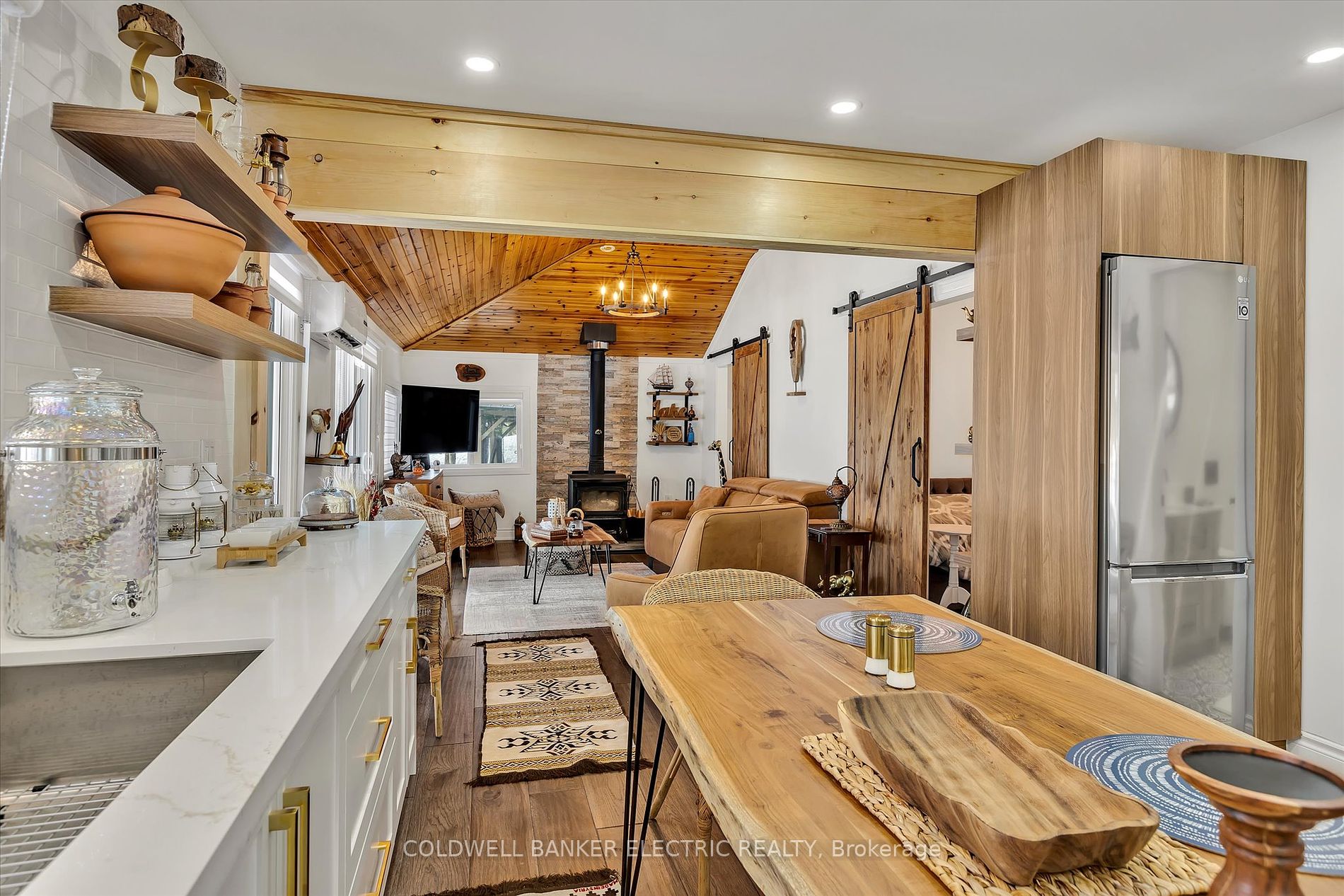 Quartz countertops and high-end appliances in bright kitchen