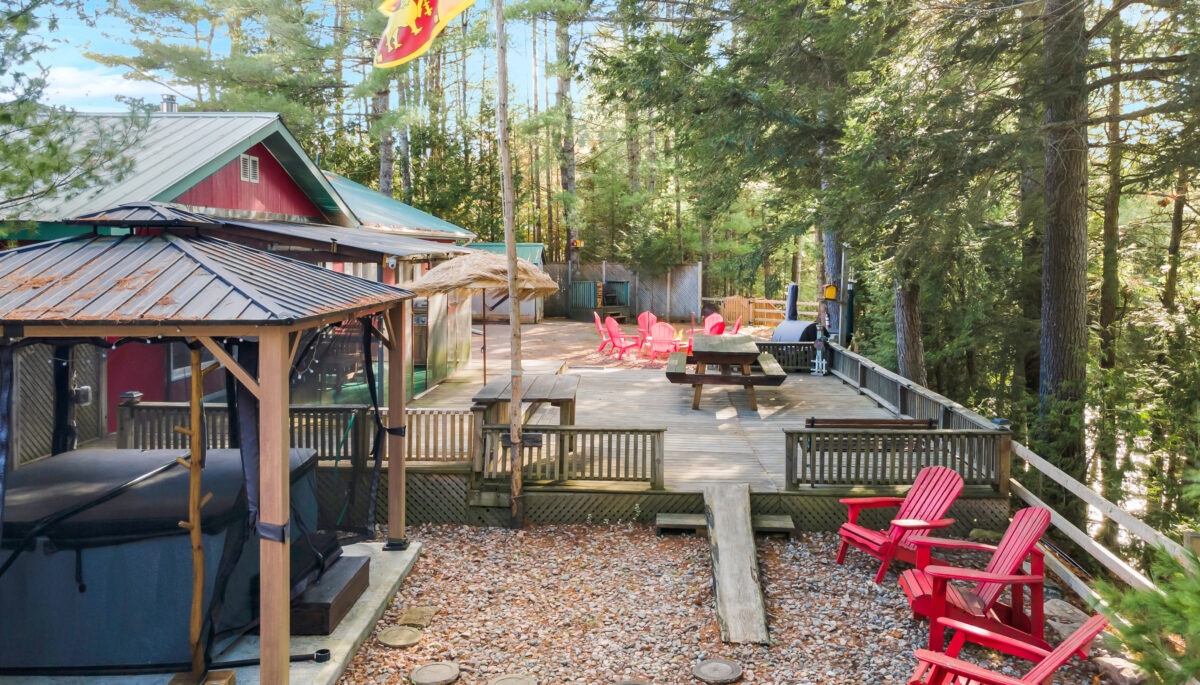 A ranch-style property with a multi-level deck