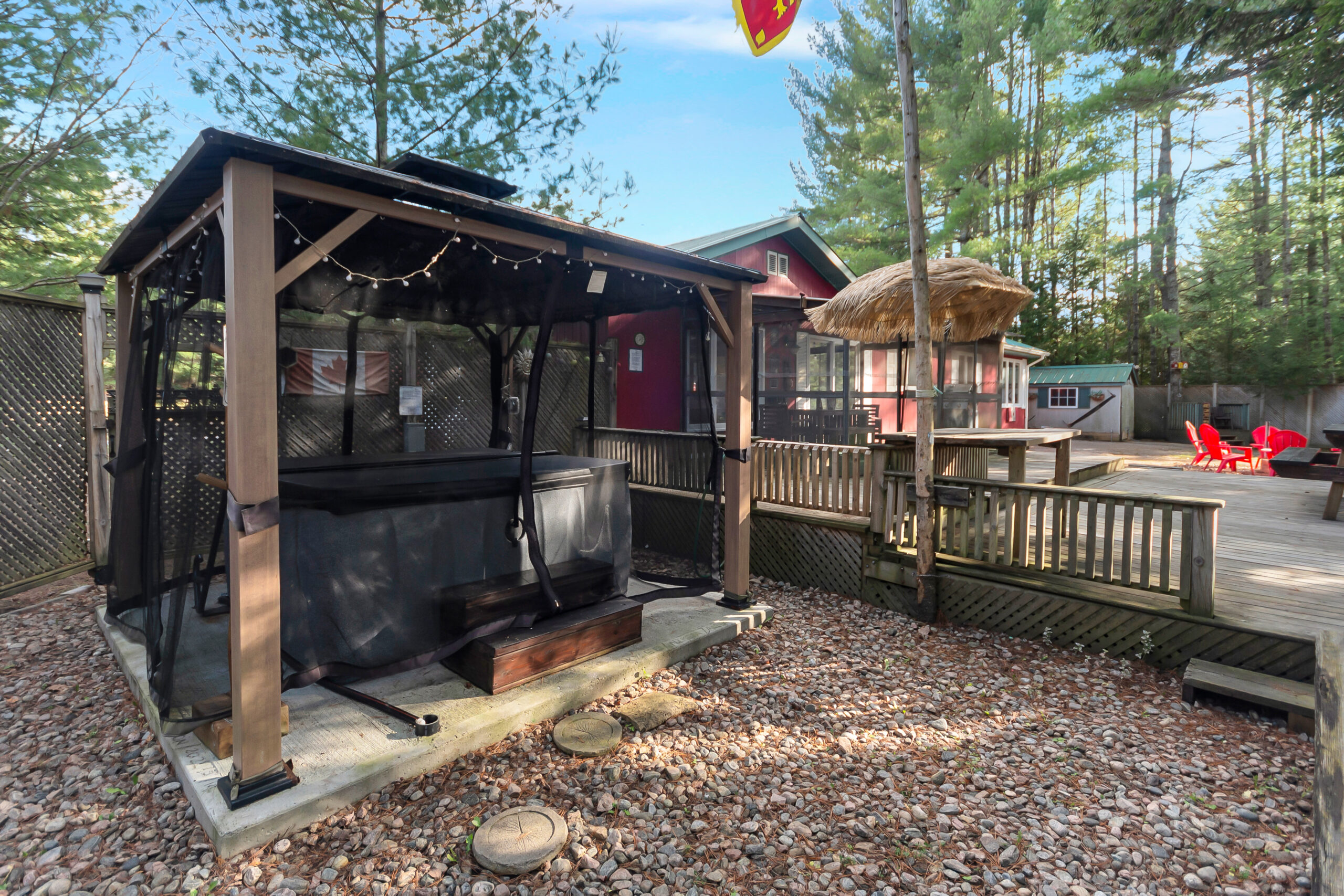 A covered hot tub with a pergola