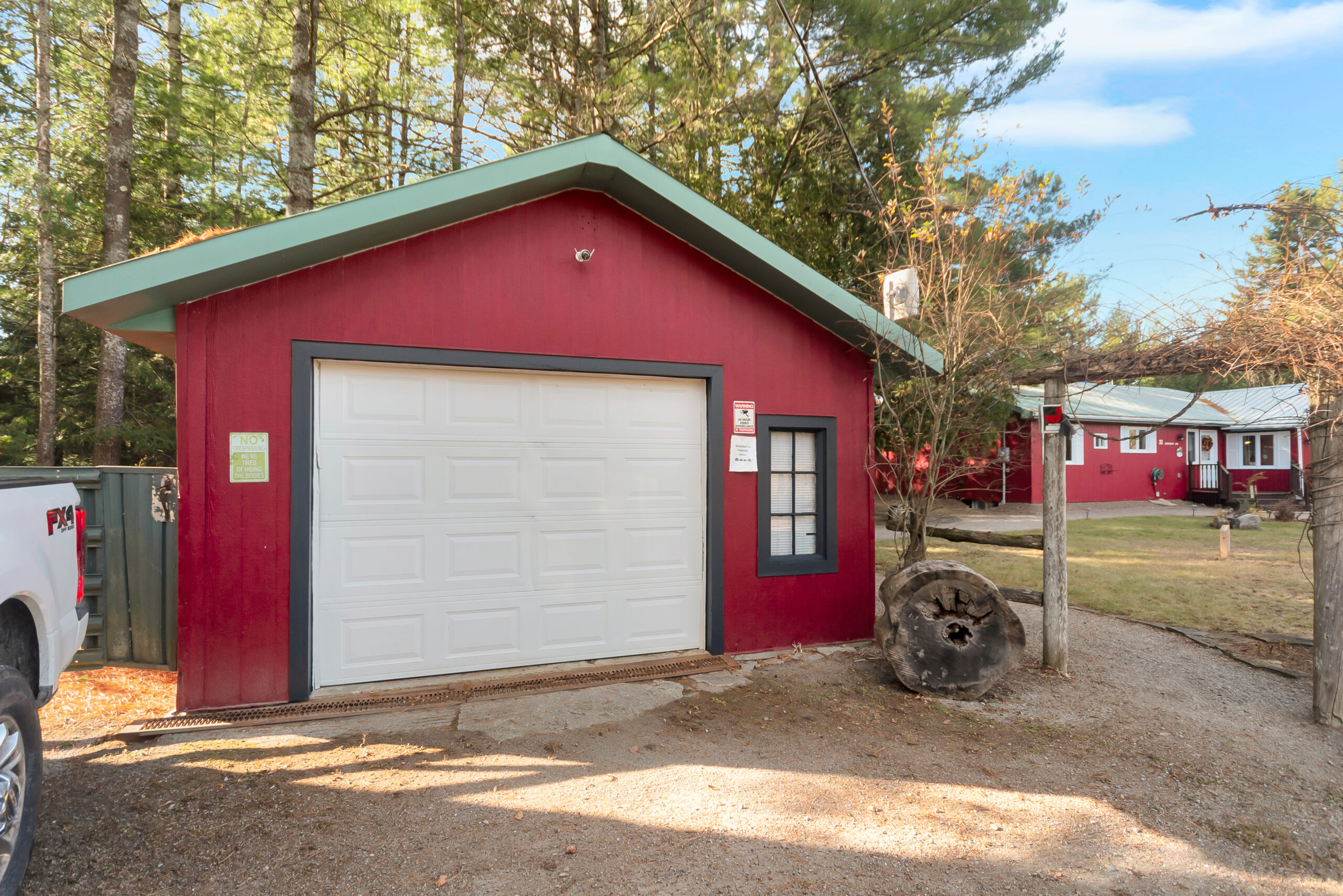 A red garage with a white garage door