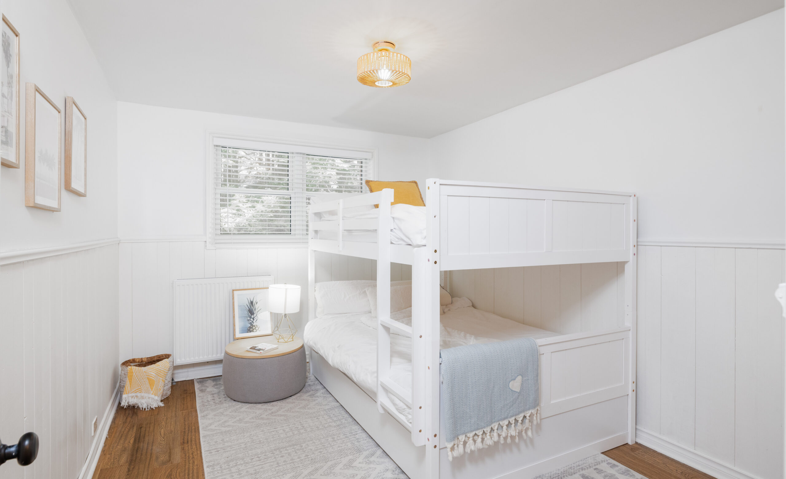 White bunk beds in a white room