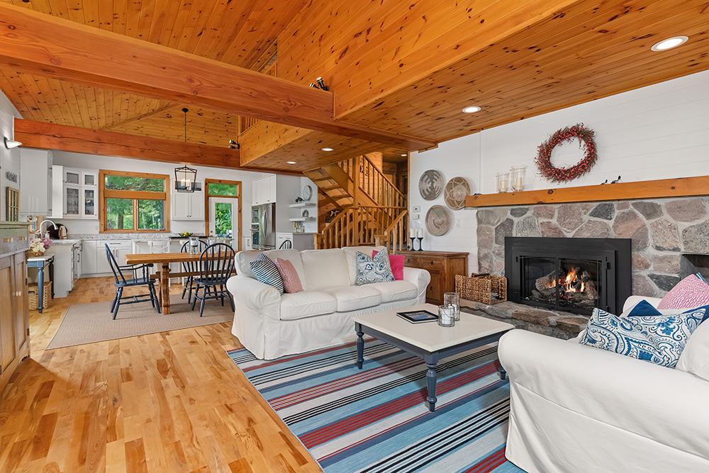 Open-concept interior showcasing seamless flow between kitchen, dining, and living spaces