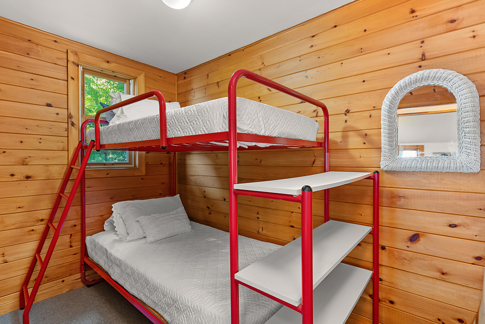 Bunk bed setup in the second bedroom of the guest cottage, ideal for kids or guests