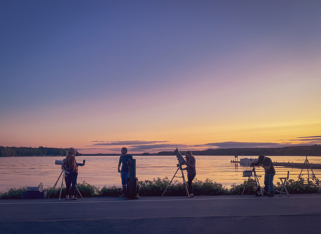 A group of stargazers gather to observe the sky
