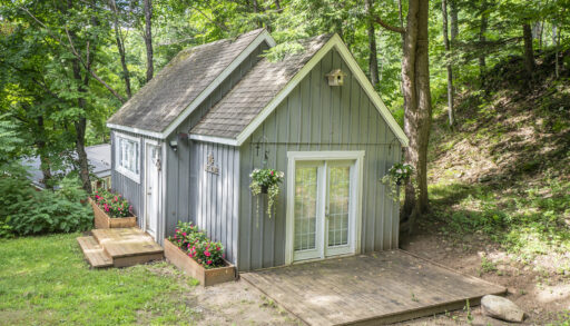 Charming bunkie surrounded by forest, offering a private retreat for guests or kids