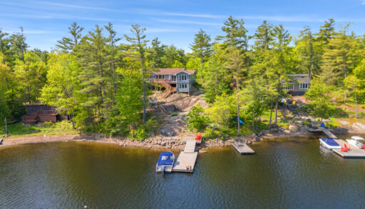 A cottage on a granite rock in the forest overlooking the lake
