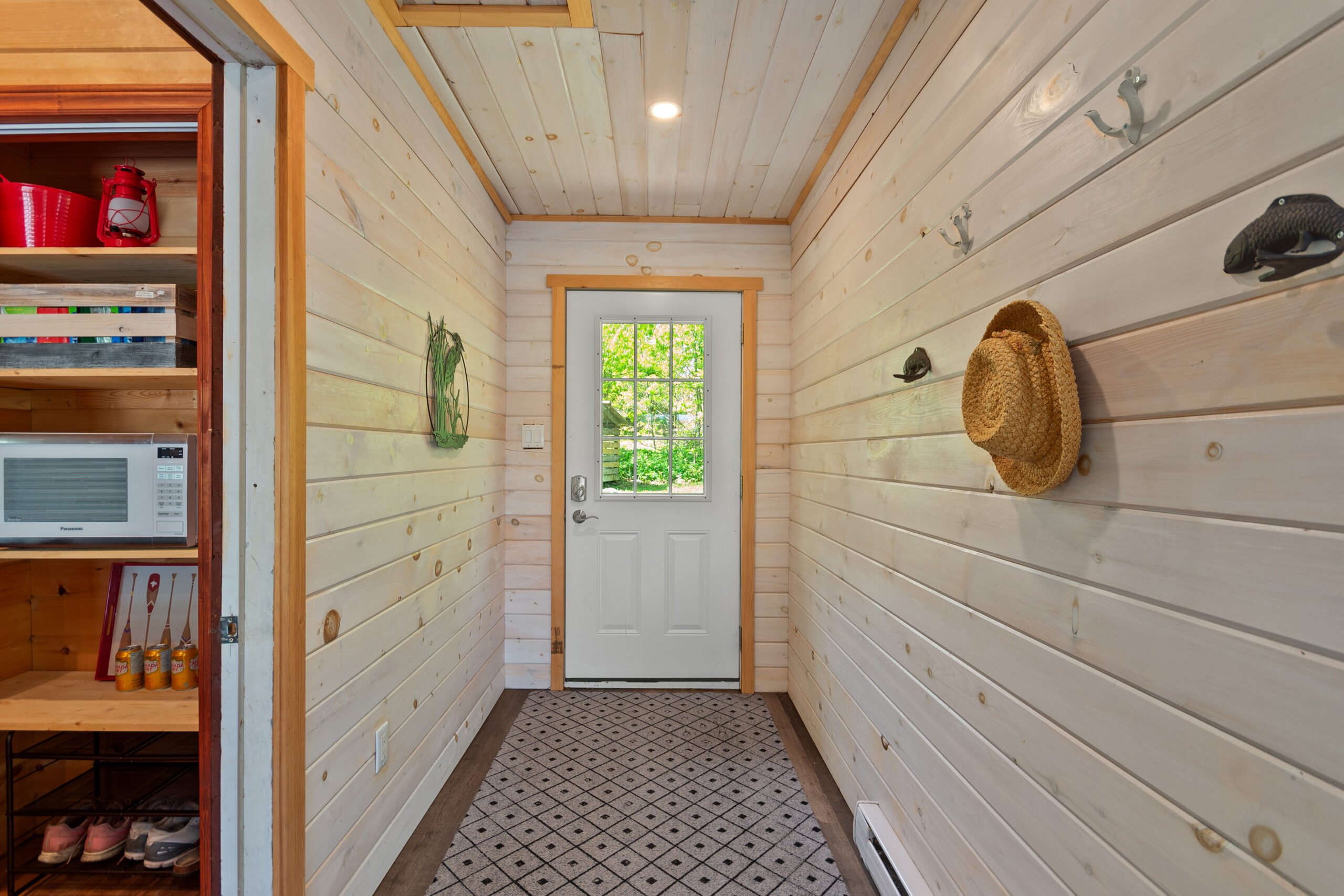 A white wood-paneled entryway