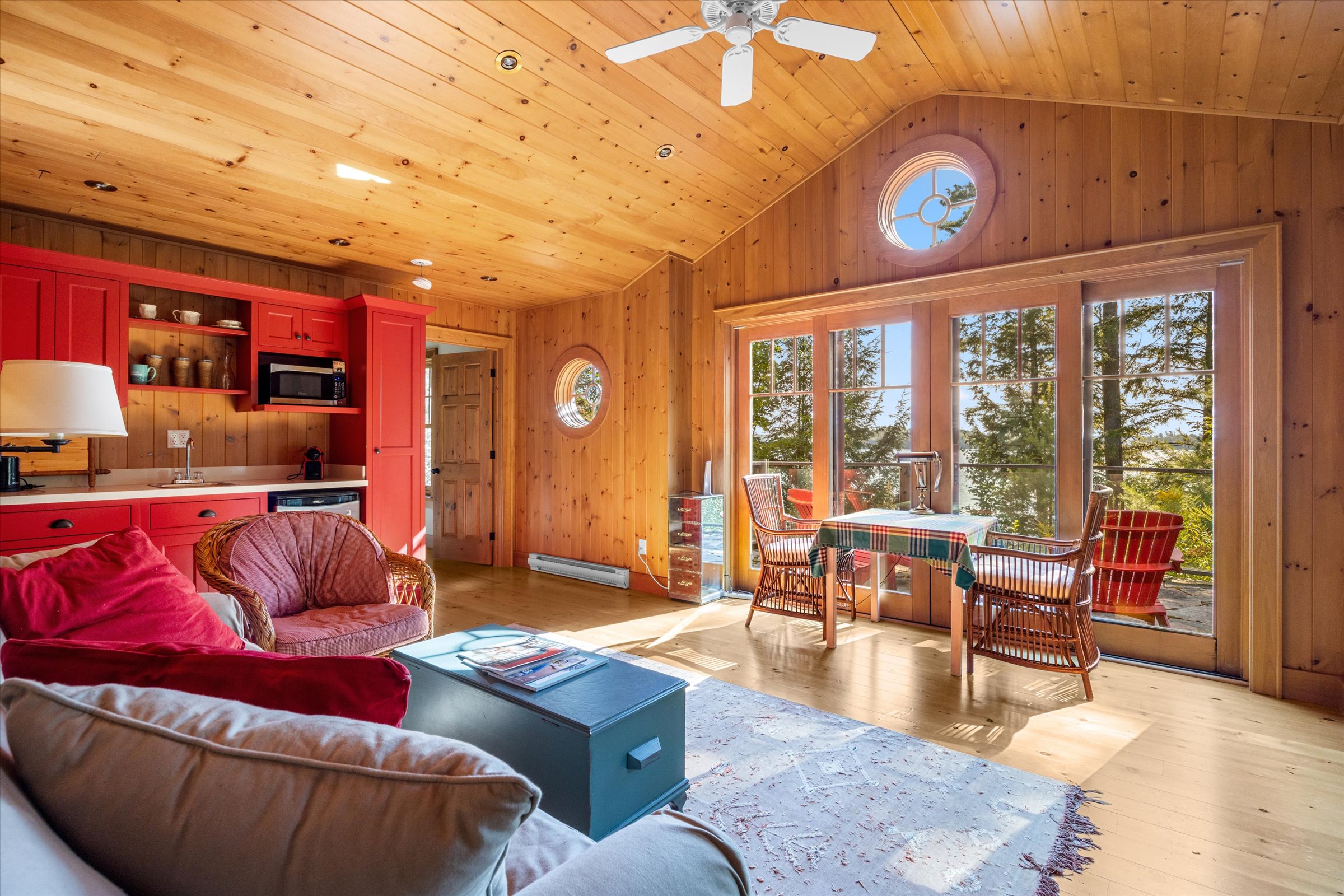 Inviting living area in the guest cottage with warm wood finishes and bright natural light
