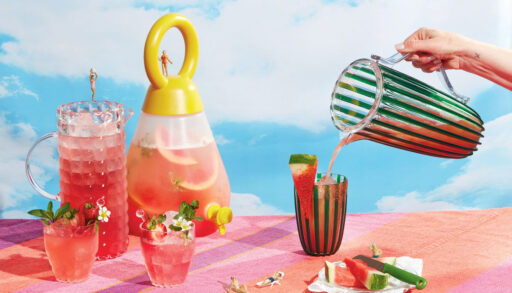 Pitchers of cocktails set against a blue sky background.