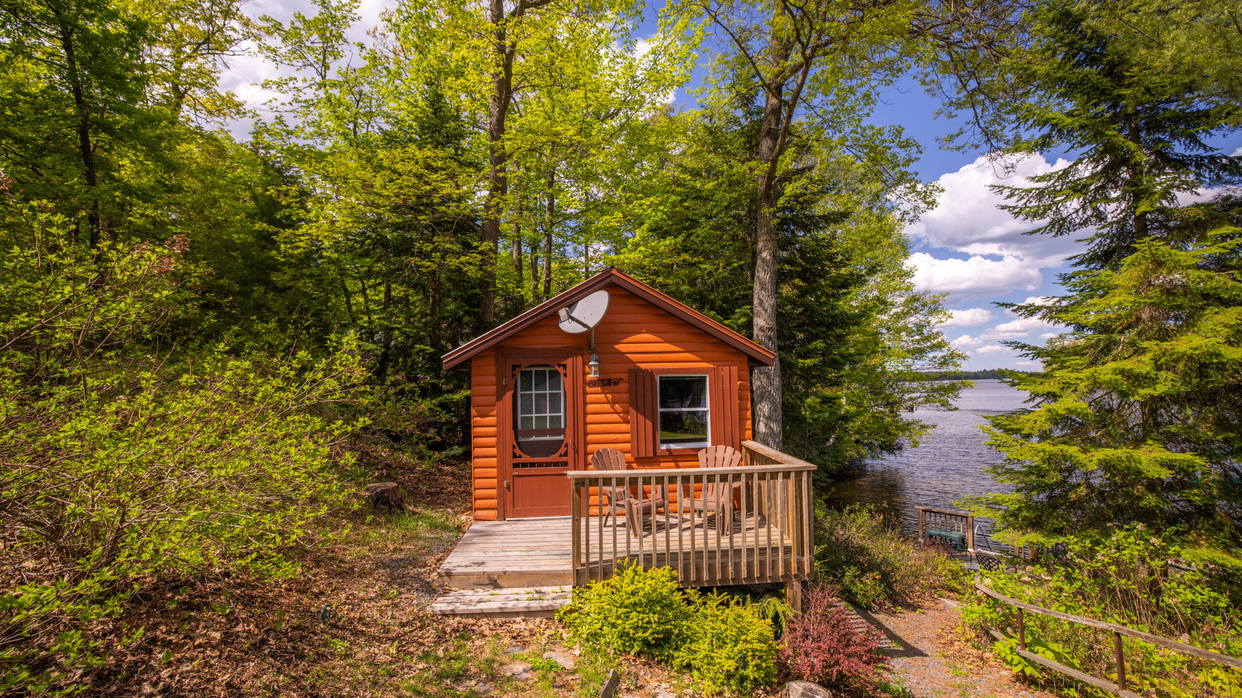 A small wood cabin nestled in the trees