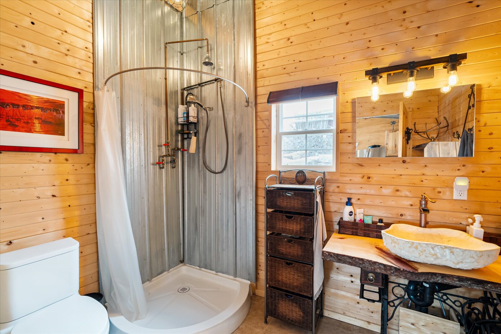 Bathroom with corrugated metal shower surround, live-edge vanity, and stone sink