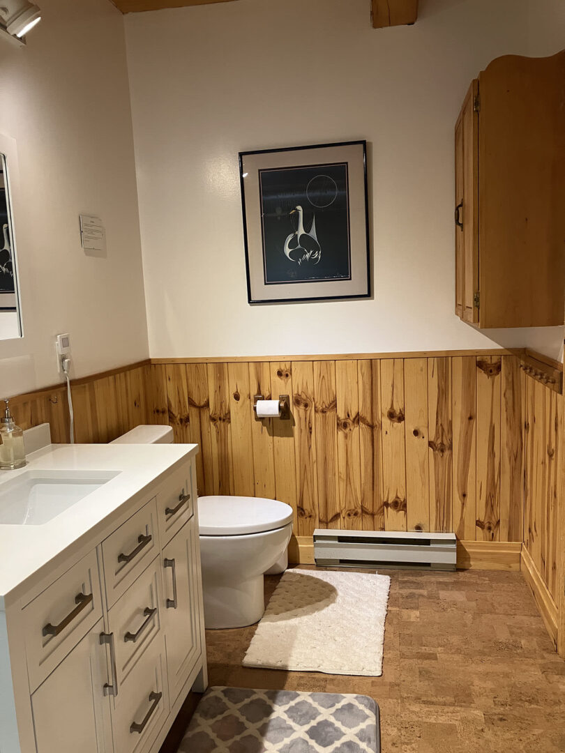 A wood and white painted bathroom