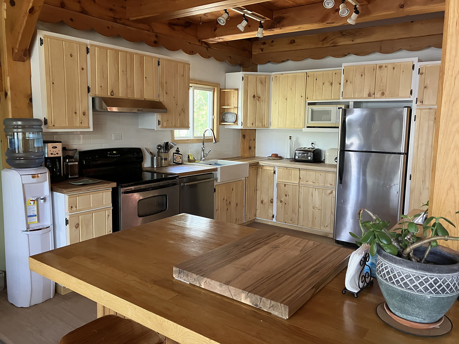 A wood kitchen with stainless steel appliances