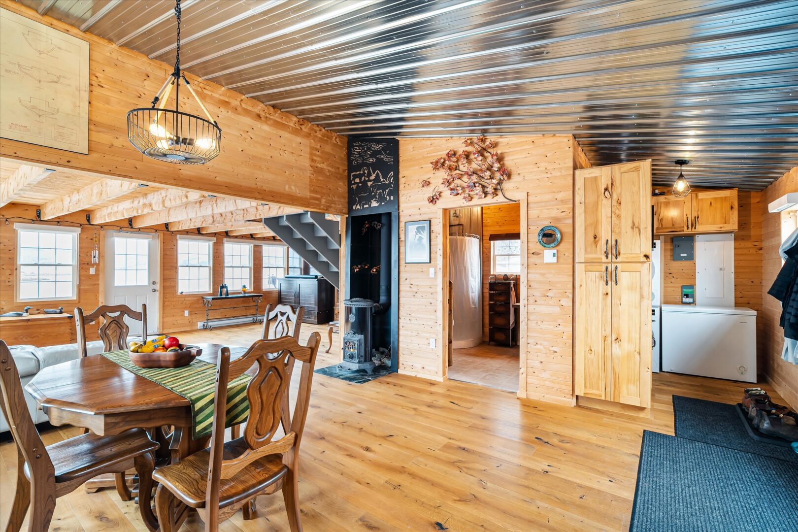View of the dining space with doorway to bath and utility area