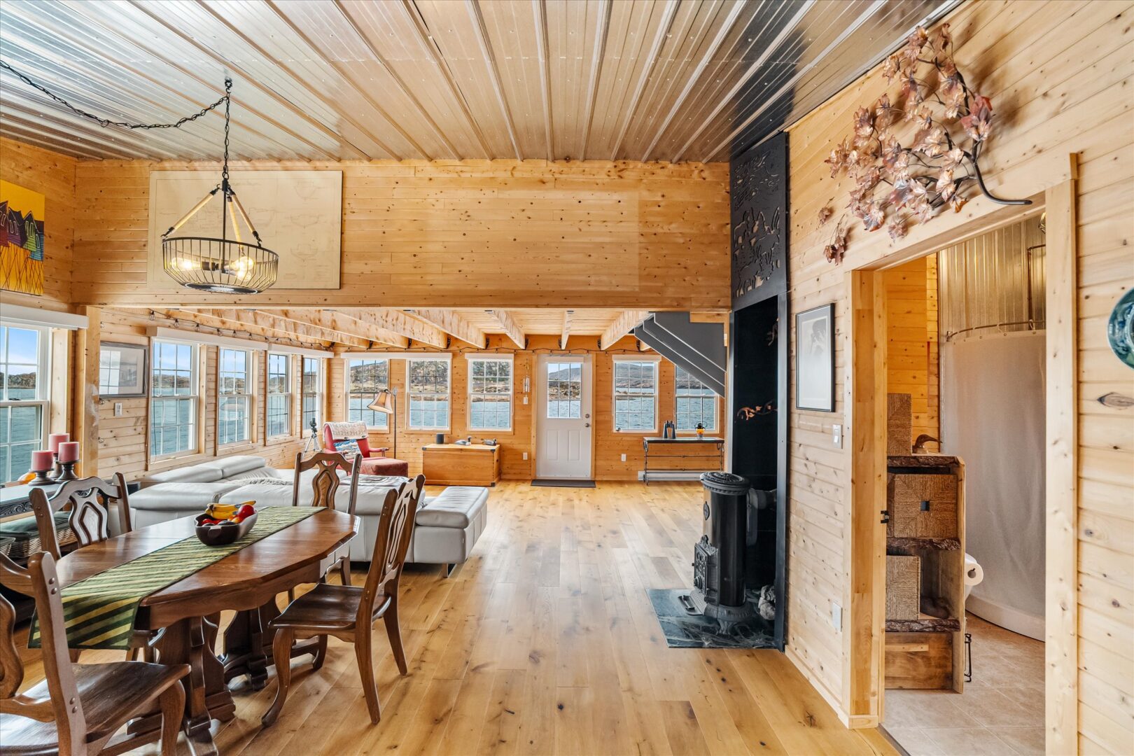 Seamless flow between kitchen, dining, and panoramic living room