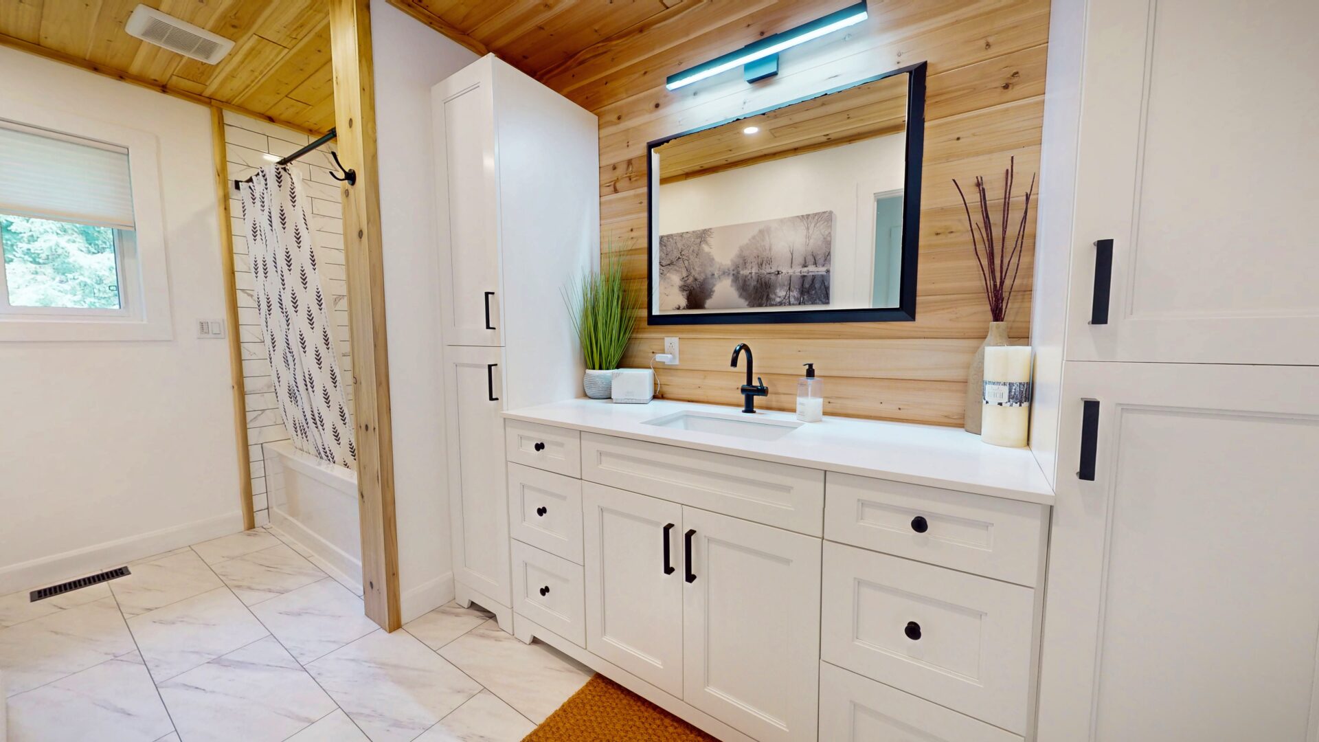 A wood-paneled bathroom with white cabinets and a white shower