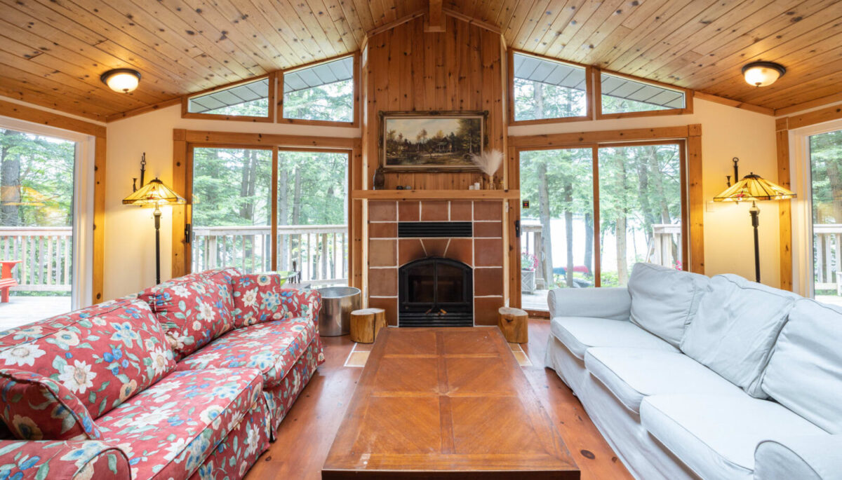 A cottage living room with vaulted ceilings