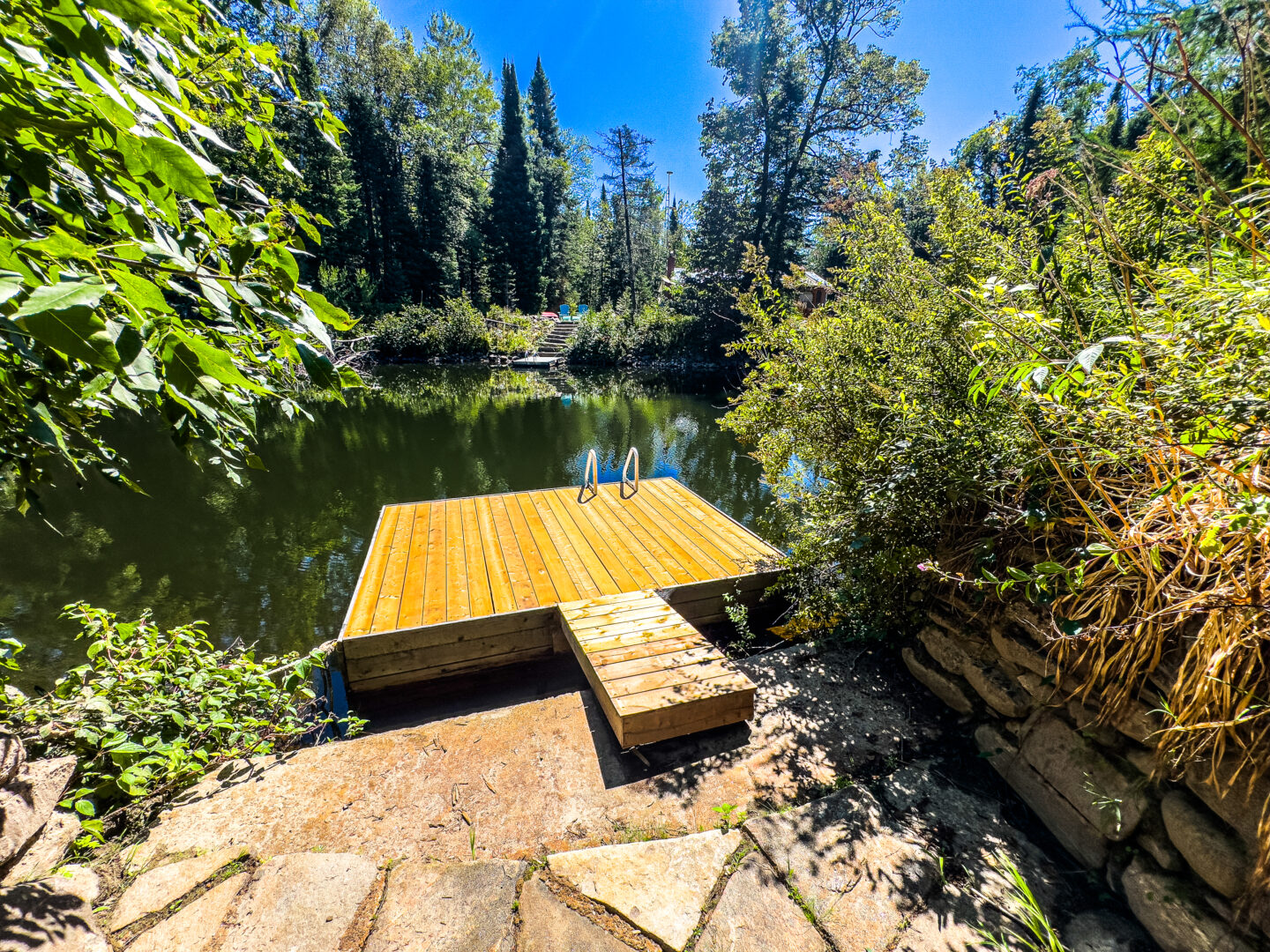 A square dock floating in the water
