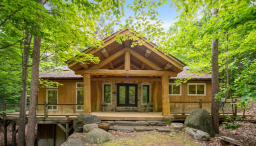 A log cabin with double glass doors