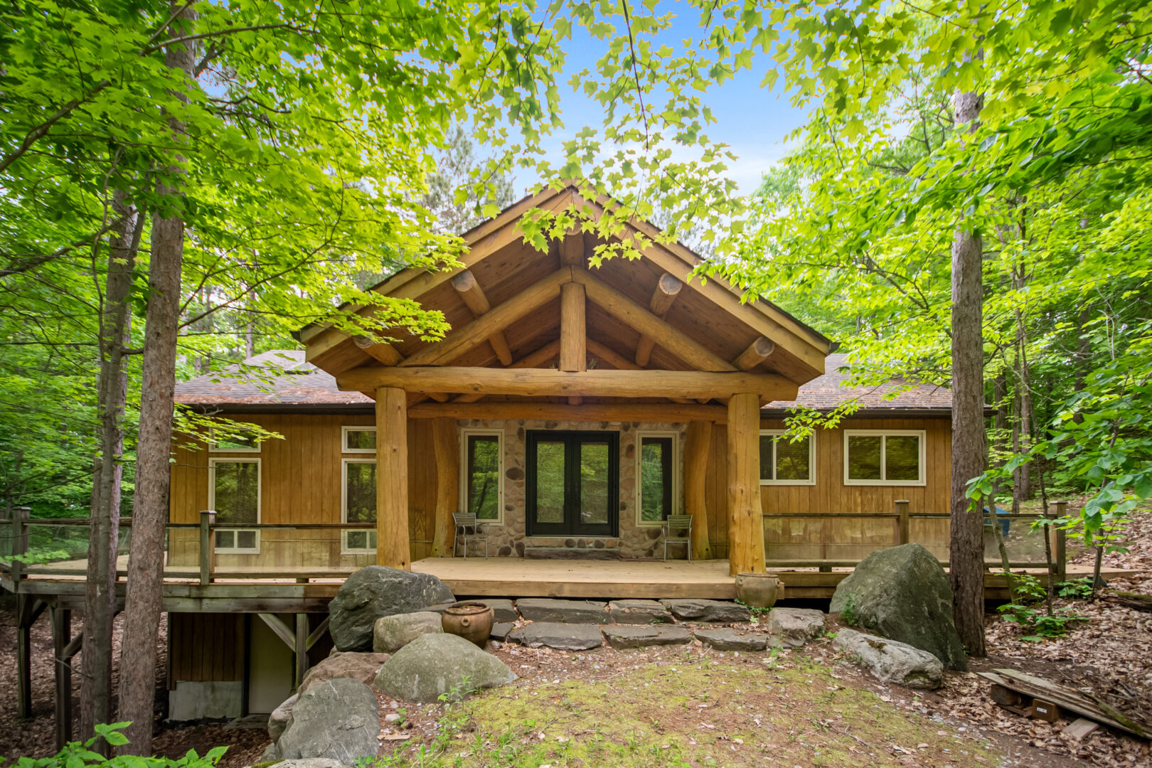 A log cabin with double glass doors