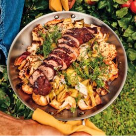 Michael Smith's pan-roasted vegetables with cinnamon-crusted pork tenderloin in a stainless steel pan