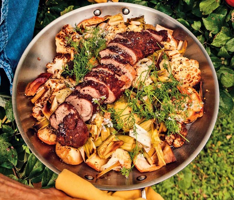 Michael Smith's pan-roasted vegetables with cinnamon-crusted pork tenderloin in a stainless steel pan