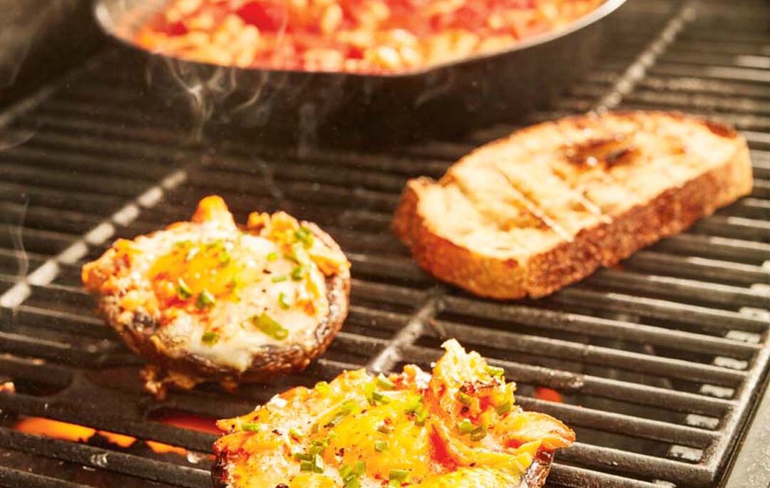 grilled portobello mushrooms with egg and smoked trout on a grill