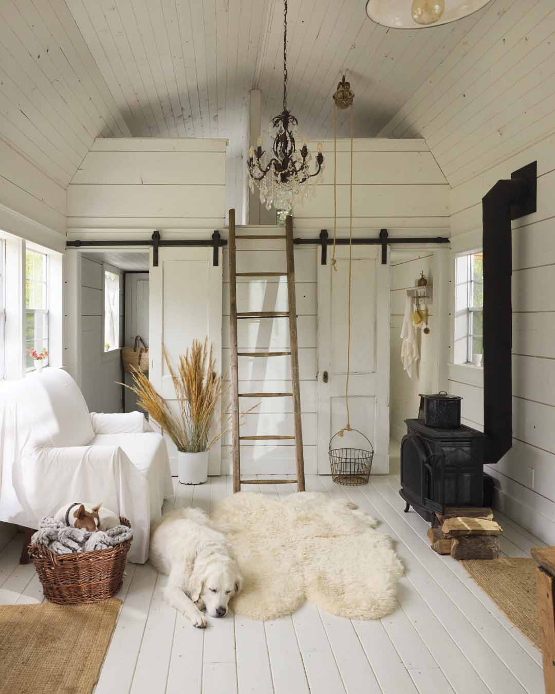 The living area of the shed with the loft seen above