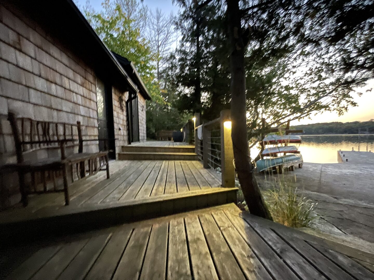 A wood deck along the lake