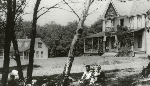 L.M. Montgomery on the veranda of the cottage she stayed at in Bala, Ont.