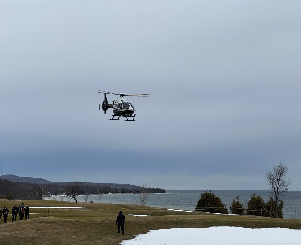 OPP helicopter landing on the golf course near Georgian Bay