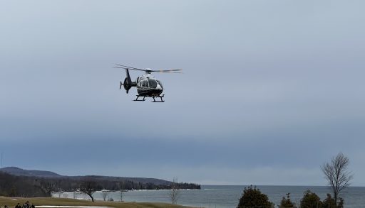 OPP helicopter landing on the golf course near Georgian Bay