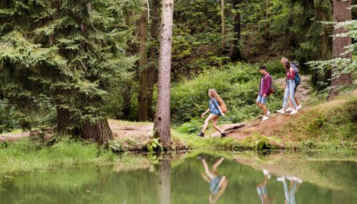 Teenagers on a hike near the lake