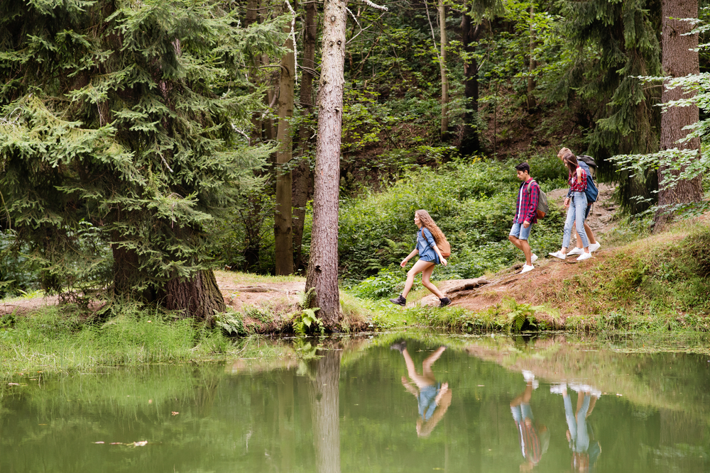 Teenagers on a hike near the lake