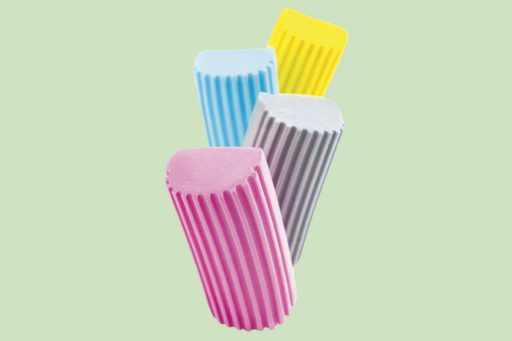 Scrub Daddy damp duster on a green background, cleaning