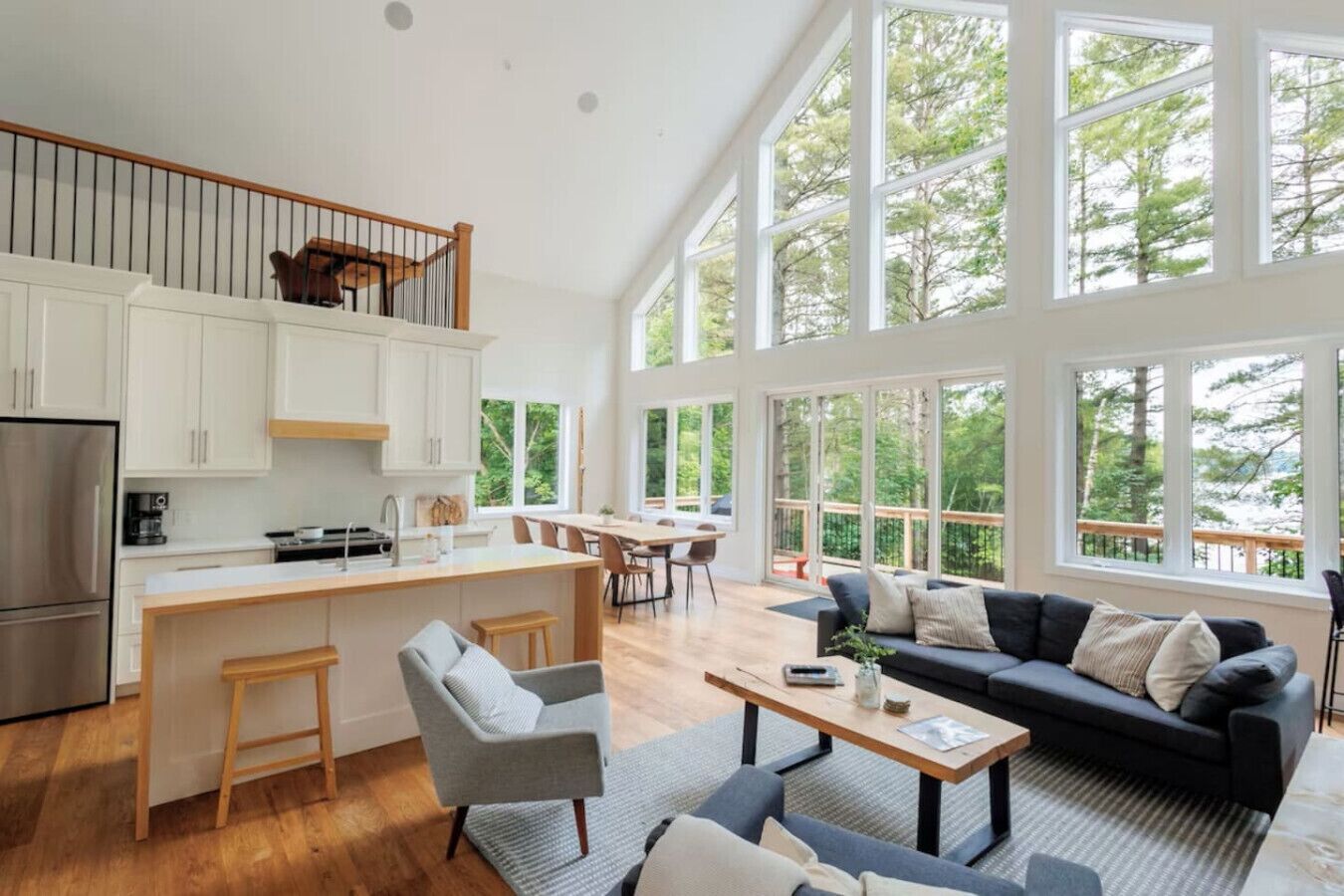 Kitchen of Sutton Lakehouse. This kitchen features white cabinets and a white island.