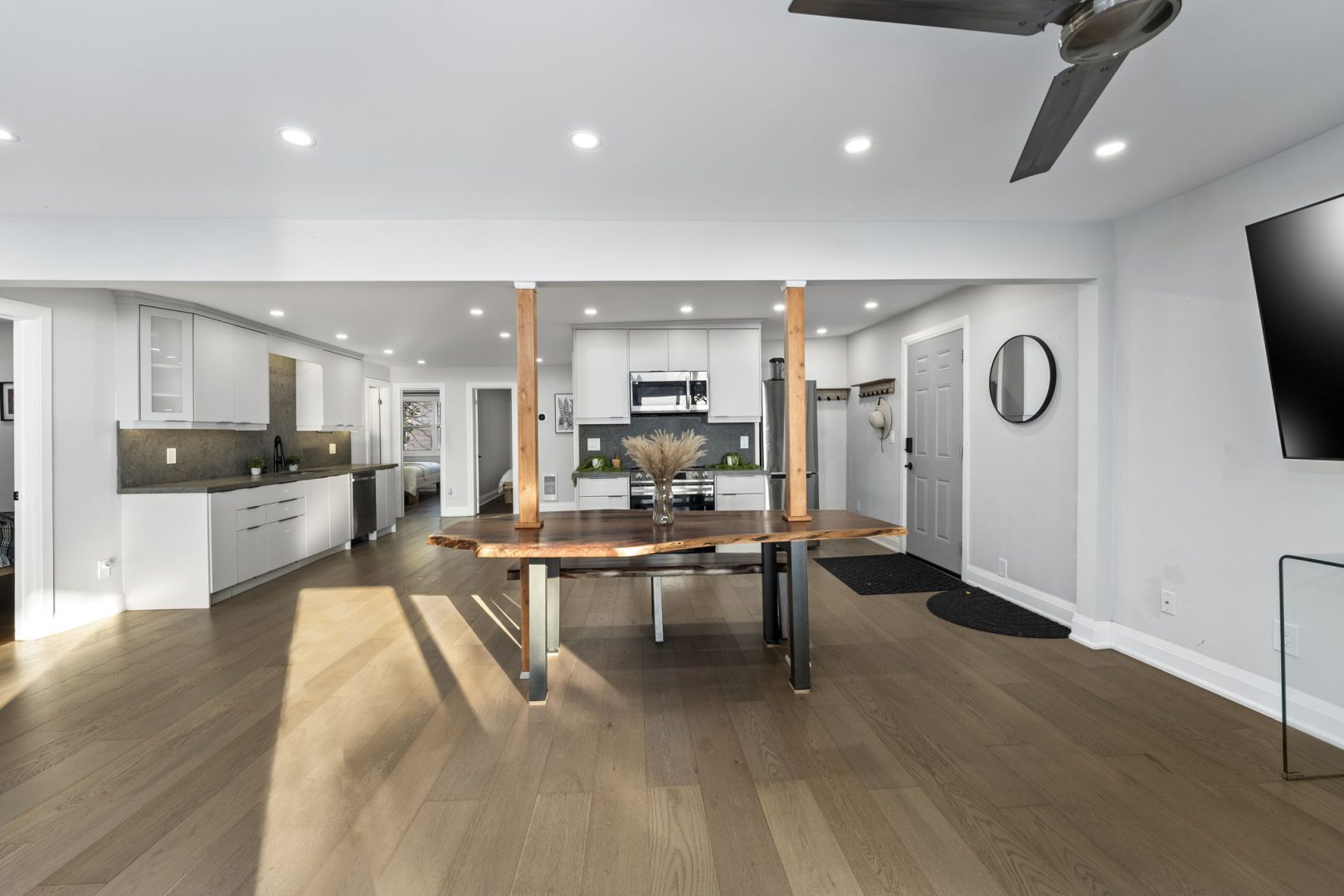 A spacious living area with a large wood dining table